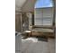 Bathroom featuring a standalone shower, soaking tub with tan tile, and a half-moon window at 135 Danube Trl, Stockbridge, GA 30281