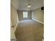 Bedroom featuring tan carpet, overhead fan, and neutral paint at 135 Danube Trl, Stockbridge, GA 30281