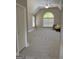 Large, airy bedroom with neutral carpet, vaulted ceilings, and a bright window at 135 Danube Trl, Stockbridge, GA 30281