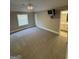 Spacious bedroom with overhead fan and a view into the en-suite bathroom at 135 Danube Trl, Stockbridge, GA 30281