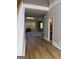 Inviting entryway with hardwood floors, staircase and entrance to a half bathroom at 135 Danube Trl, Stockbridge, GA 30281