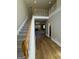 Welcoming entryway with hardwood floors, staircase, and views into the living space at 135 Danube Trl, Stockbridge, GA 30281