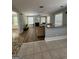 Comfortable living room featuring a fireplace, large windows, and new flooring at 135 Danube Trl, Stockbridge, GA 30281