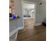 Open living room view through doorway, featuring hardwood floors and ample natural light at 135 Danube Trl, Stockbridge, GA 30281