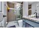 Updated bathroom featuring a sleek glass shower, modern fixtures, and a stylish vanity with storage at 2582 Rosecommons Dr, Hampton, GA 30228