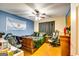 Bedroom with blue accent wall, ceiling fan and hardwood floors at 2582 Rosecommons Dr, Hampton, GA 30228
