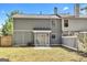 Exterior view of a backyard with a patio, wood fence and lawn at 2998 Kenville Ln, Decatur, GA 30034