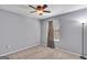 Bedroom highlighting neutral carpet, natural lighting from a window, and ceiling fan at 2998 Kenville Ln, Decatur, GA 30034