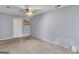 Bedroom showcasing a ceiling fan, neutral carpet, and ample space, with a closet at 2998 Kenville Ln, Decatur, GA 30034