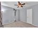 Neutral carpet bedroom with two closet doors and ceiling fan for comfort at 2998 Kenville Ln, Decatur, GA 30034