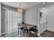 Cozy dining area with a chandelier, table, and chairs, adjacent to a laundry closet at 2998 Kenville Ln, Decatur, GA 30034