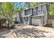 Attractive two-story home with a garage, showcasing its curb appeal and architectural details at 2998 Kenville Ln, Decatur, GA 30034