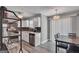 Well-lit kitchen with modern appliances, white cabinetry, and a dining area at 2998 Kenville Ln, Decatur, GA 30034