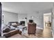 Cozy living room featuring a fireplace, comfortable sofas, and stylish decor at 2998 Kenville Ln, Decatur, GA 30034
