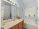 The bathroom shows a single sink vanity, an oval tub, and a large mirror at 2040 Elm Grove Ln, Hampton, GA 30228