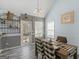 Cozy dining area with modern decor, chandelier lighting, and access to the backyard at 2040 Elm Grove Ln, Hampton, GA 30228