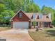 Charming single Gathering home with mature trees and landscaping at 2040 Elm Grove Ln, Hampton, GA 30228