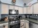 Kitchen with modern appliances, ample cabinet space, and countertops at 2040 Elm Grove Ln, Hampton, GA 30228