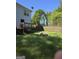 Backyard view of the deck, fence and fire pit at 1232 Memorial Se Dr, Atlanta, GA 30316