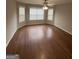 Bedroom featuring hardwood floors, a ceiling fan, and large windows at 1232 Memorial Se Dr, Atlanta, GA 30316