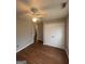 Bedroom featuring a ceiling fan, laminate floors, and a double-door closet at 1232 Memorial Se Dr, Atlanta, GA 30316