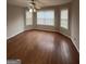 Bright bedroom featuring hardwood floors, a ceiling fan, and large windows for natural light at 1232 Memorial Se Dr, Atlanta, GA 30316