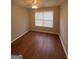 Bedroom with a ceiling fan, laminate floors, and natural light from the window at 1232 Memorial Se Dr, Atlanta, GA 30316