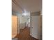 Hallway with laminate floors and neutral paint, featuring a light fixture in the ceiling at 1232 Memorial Se Dr, Atlanta, GA 30316