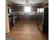 Kitchen featuring stainless steel appliances, dark wood cabinets, and modern fixtures at 1232 Memorial Se Dr, Atlanta, GA 30316