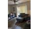 Cozy living room with ample seating and a ceiling fan at 1331 Woodstone Trce, Morrow, GA 30260
