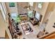 Bright living room with stone fireplace, high ceilings, and large windows, creating a spacious, inviting atmosphere at 4335 Burgomeister Pl, Snellville, GA 30039