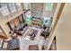 Bright living room with stone fireplace, high ceilings, and large windows, creating a spacious, inviting atmosphere at 4335 Burgomeister Pl, Snellville, GA 30039