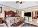 Spacious Primary bedroom with a trey ceiling, stylish furniture, walk-in closet, and bright natural light at 4335 Burgomeister Pl, Snellville, GA 30039
