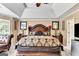 Spacious bedroom features trey ceiling, stylish furniture, and large windows for natural light at 4335 Burgomeister Pl, Snellville, GA 30039