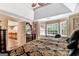 The well-lit Primary bedroom boasts a lovely ceiling fan and windows that fill the space with natural light at 4335 Burgomeister Pl, Snellville, GA 30039