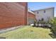 Grassy backyard with fence, garage, storage, and ample gardening space at 175 Central Ave, Fayetteville, GA 30214