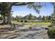 Relaxing common area featuring comfortable seating, shade trees, and a peaceful setting for residents at 175 Central Ave, Fayetteville, GA 30214
