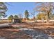 Outdoor community space with a covered structure, picnic tables, and scenic natural surroundings at 175 Central Ave, Fayetteville, GA 30214
