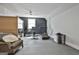 Spacious home gym with modern exercise equipment, providing a convenient fitness space at 175 Central Ave, Fayetteville, GA 30214