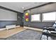 Entertainment room features a projector screen, storage chest, and plush seating at 175 Central Ave, Fayetteville, GA 30214