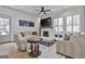 Bright and airy living room with a fireplace, plush seating, and stylish decor with hardwood floors at 175 Central Ave, Fayetteville, GA 30214