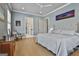 Spacious main bedroom featuring hardwood floors, ample natural light, and ensuite bathroom access at 175 Central Ave, Fayetteville, GA 30214