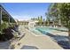 Inviting community pool area with ample seating for residents to relax and enjoy the sunny weather at 175 Central Ave, Fayetteville, GA 30214