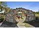 Unique stone archway offers a tranquil view of the pond and comfortable seating for relaxation at 175 Central Ave, Fayetteville, GA 30214