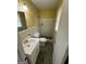 Cozy bathroom featuring a single sink vanity, a toilet, and tiled walls at 5730 Koweta Rd, South Fulton, GA 30349