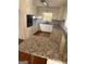 Bright kitchen with granite countertops, white cabinetry, and a functional layout at 5730 Koweta Rd, South Fulton, GA 30349