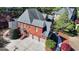 Beautiful brick home featuring a three-car garage and meticulously manicured landscaping at 10125 Brixton Pl, Suwanee, GA 30024