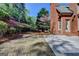 Backyard featuring brick detail and patio at 10125 Brixton Pl, Suwanee, GA 30024