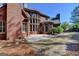 Backyard featuring brick detail and patio at 10125 Brixton Pl, Suwanee, GA 30024