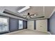 Bedroom features blue walls, carpet floors, and ceiling fan with lighting at 10125 Brixton Pl, Suwanee, GA 30024